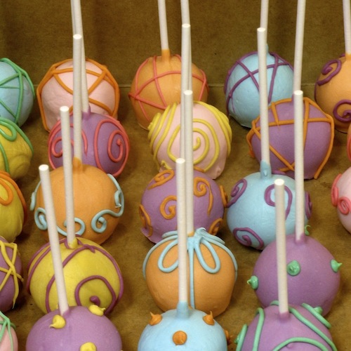 cake balls on a stick. colorful cake balls in an